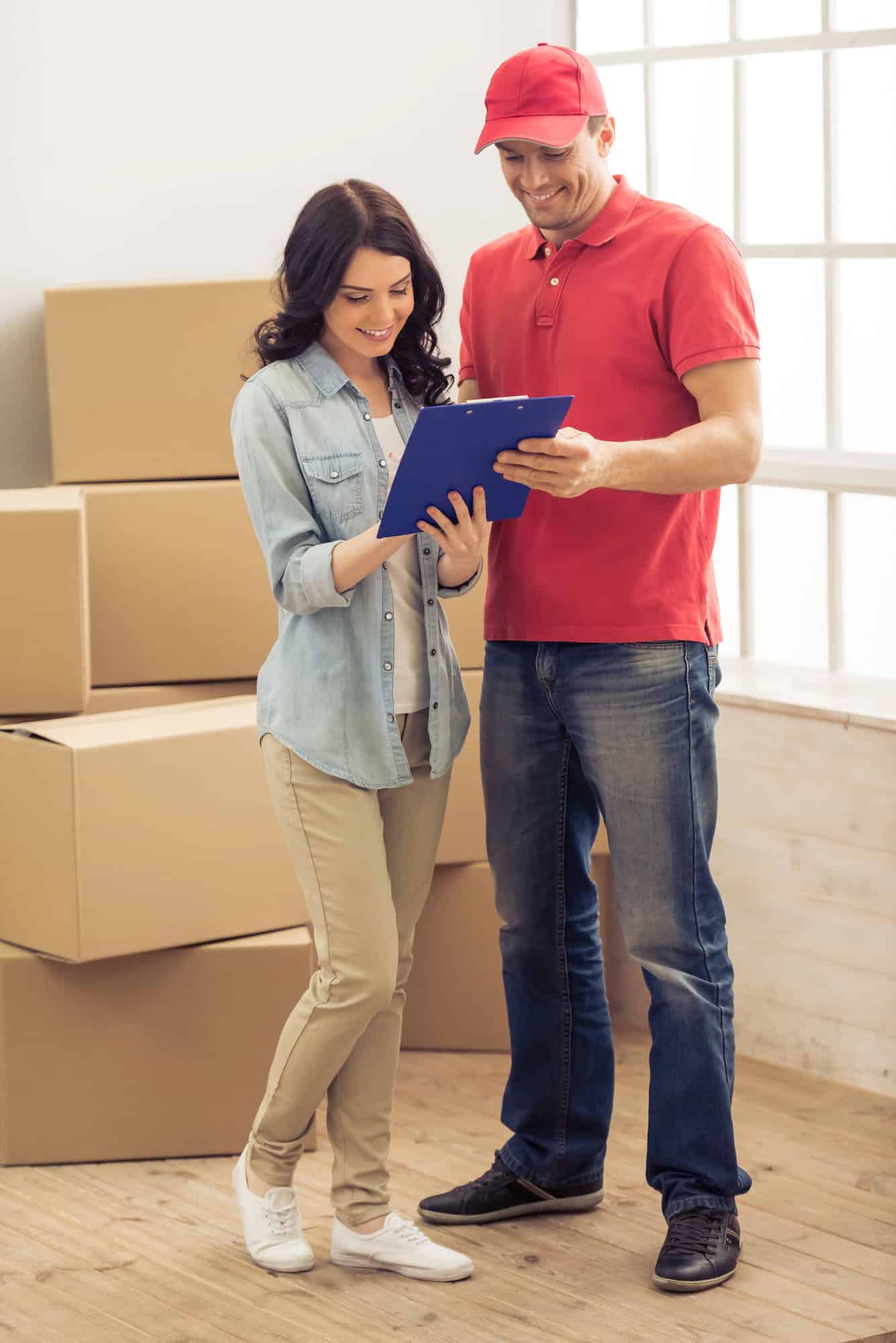 Couple moving boxes into a new Cincinnati apartment