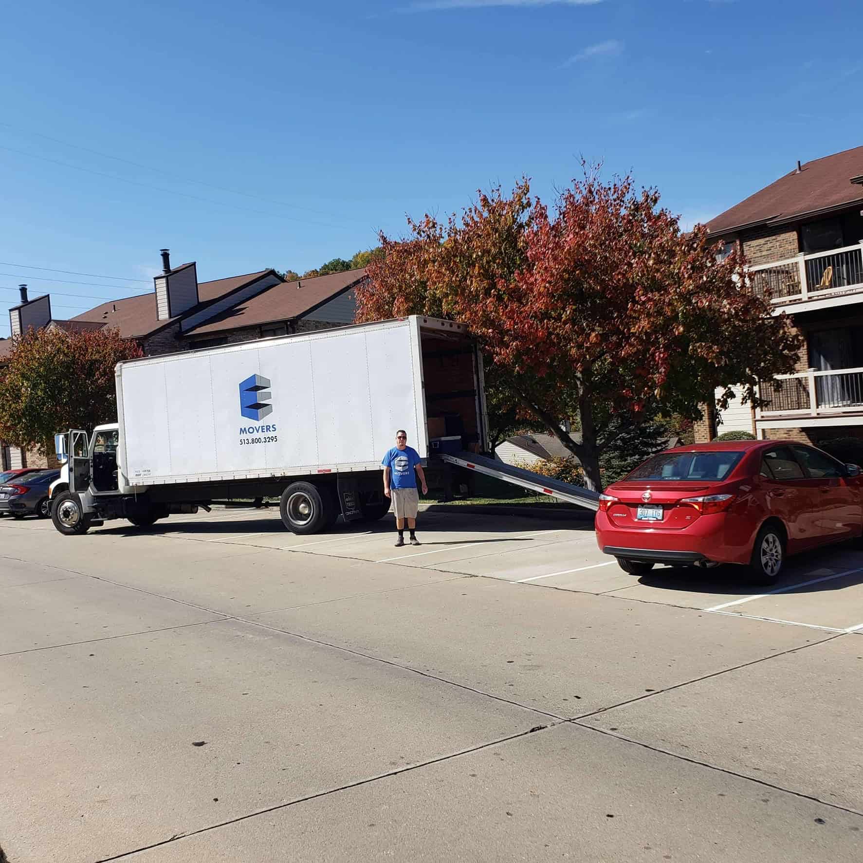 Elite Movers truck parked in front of Cincinnati apartments